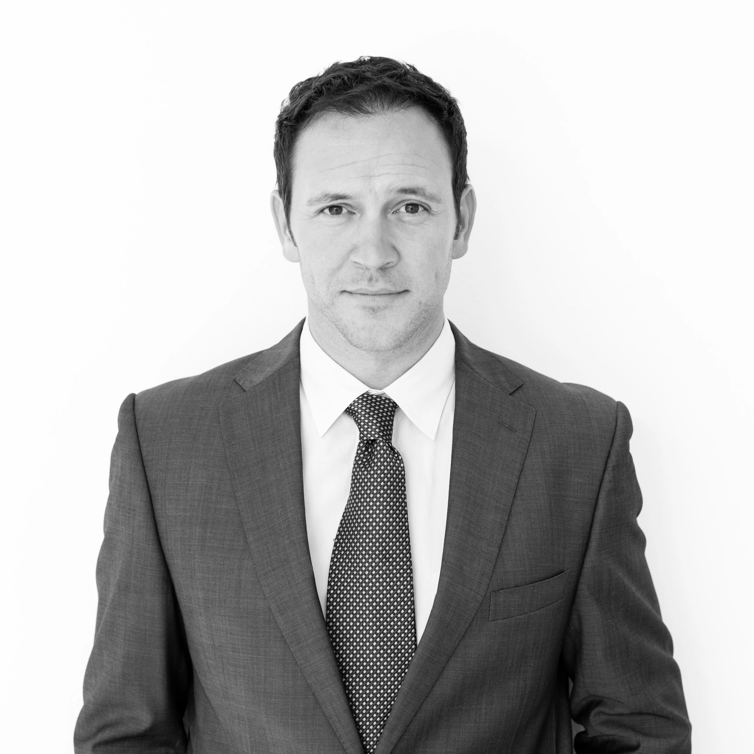 Black and white headshot of a businessman