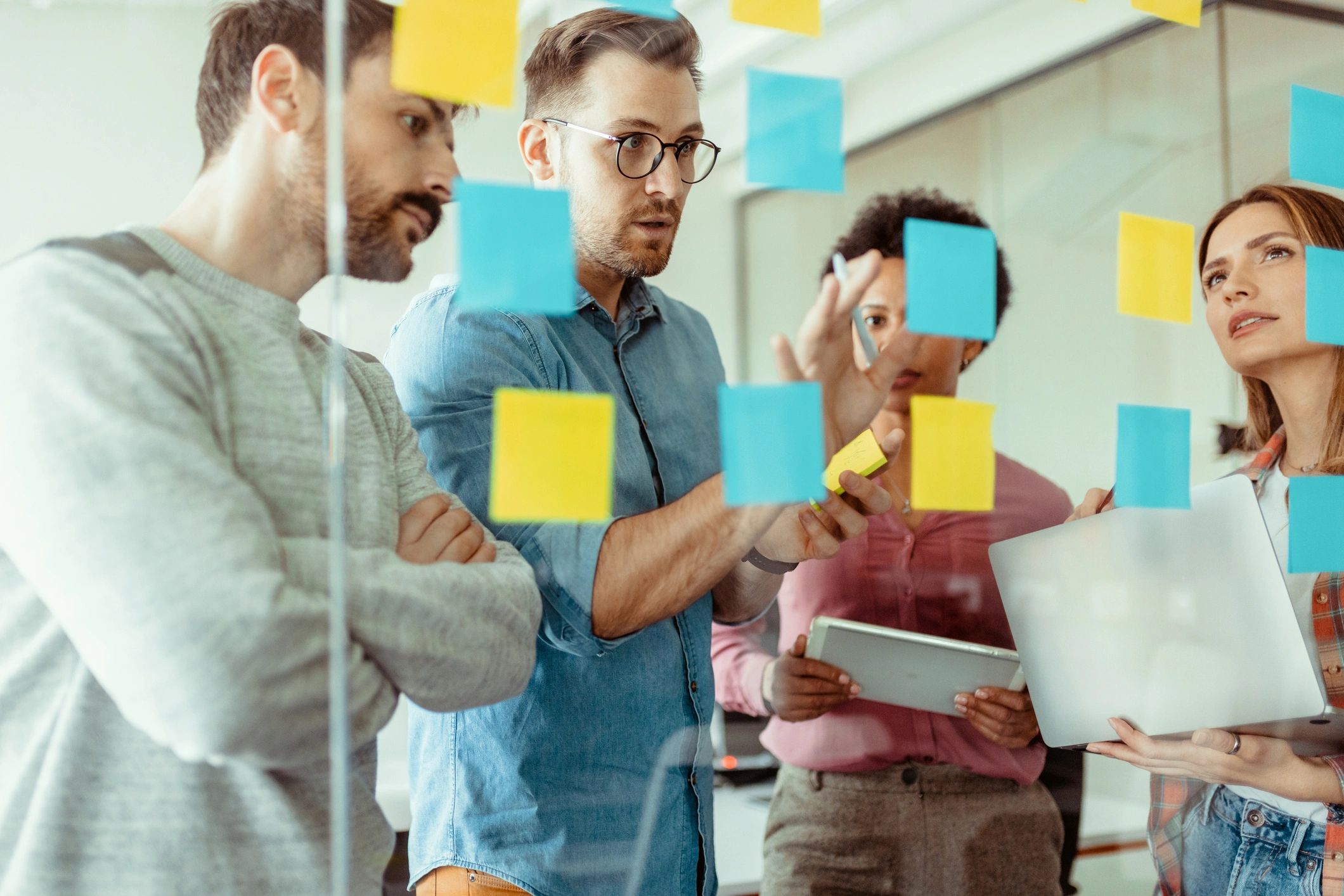 Team collaborating with sticky notes during a strategy session